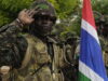 A Gambian soldier salutes during Senegal????????s national anthem during the opening ceremonies for Western Accord 2012, Thi????s, Senegal, July 9, 2012. U.S. service members, primarily reservists and guardsmen from the Army, Navy, Air Force and Marines are taking part in Western Accord, a multi-lateral exercise with Senegalese and several Western African nations.